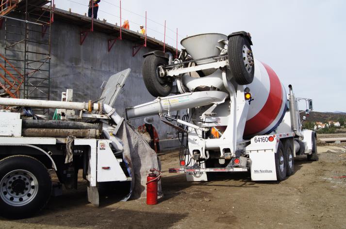 Cement truck delivering to concrete snorkel