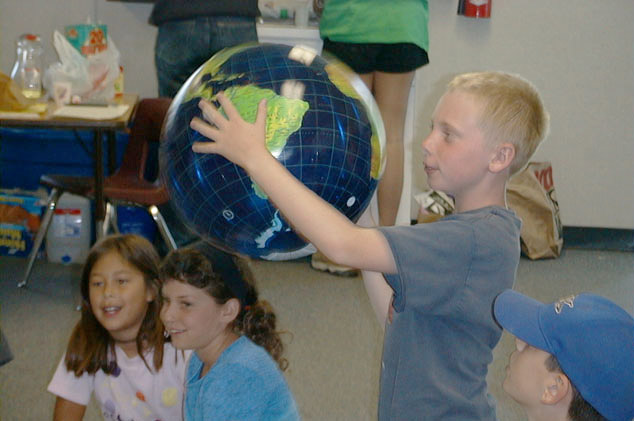 Young student holding globe